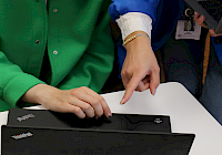 Illustration. Two people working and watching a computer screen on the desktop.